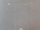 a close up of a piece of fabric with holes in it