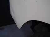 a close up of the front of a white car