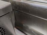 stainless steel counter top with a sink in a commercial kitchen