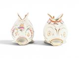 two small vases that are sitting next to each other
