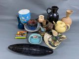many different vases and other items on the table