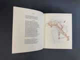 an open book with a drawing of a man ' s torso on it
