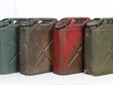 several different colors of gas cans lined up in a row