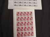 a black shirt with a red stamp on it next to a sheet of paper