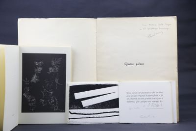 three open books sitting on top of a table next to each other
