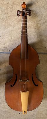 a violin hanging on the wall next to a wall
