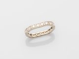 a white gold ring with diamonds on a white background