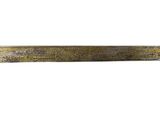 a gold colored sword with a long blade on a white background
