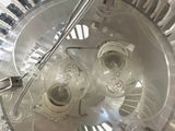 a close up view of a fan that is on the ceiling