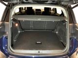 a trunk of a car with the back seats folded open