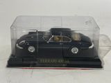 a black car in a clear box on a white surface