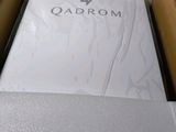 an open cardboard box with a white shirt inside of it