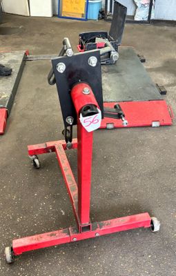 a picture of a red machine in a garage