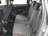 a car that has two rows of seats in it