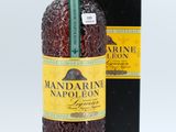 a close up of a bottle of wine next to a box