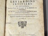 an old book that is open on a table