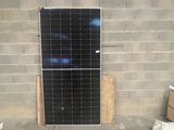 a photo of a solar panel on the side of a building
