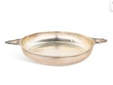 an antique silver plate with handles and handles on a white background