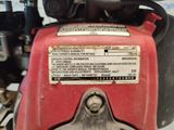 a close up of a red and black engine on a motorcycle