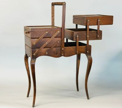 an old wooden table with drawers and a drawer on it