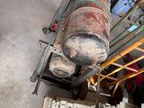 a large metal tank sitting on top of a metal rack