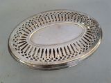 a silver plate with a decorative design on it
