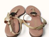pair of women ' s sandals on a white surface with a white background