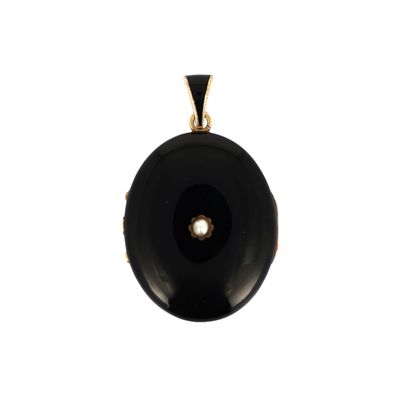 an image of a black stone pendant with a pearl in the center