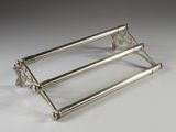 an image of a silver plated towel rack on a white surface
