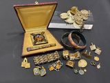 a lot of gold and silver jewelry on a table
