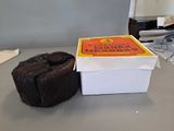 a box of donuts sitting on a table next to a box of donuts