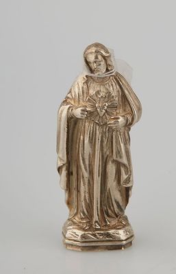 a silver statue of a woman with a veil on her head