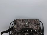 black and brown handbag with studded handle and shoulder strap