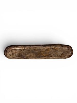 a close up of a knife on a white surface with a white background