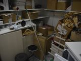 a room with a lot of boxes and boxes on the shelves