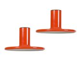 pair of orange and white pendant lights on a white background