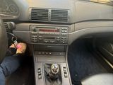 a person sitting in the driver seat of a car with their foot on the dashboard