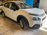 a white car that is parked in a garage