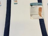 two pieces of cloth are folded on top of each other on a table