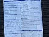 an image of a paper with a picture of a car ' s driver ' s license on it