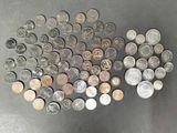 a lot of coins that are on the table