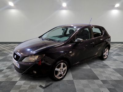 a black car that is parked in a room