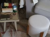 a small table with books on it in a living room