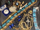 a lot of jewelry that is laying out on a table