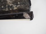 a small piece of lace on the edge of a purse