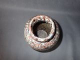 a small vase that is sitting on a table