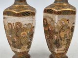 pair of japanese satsum vases decorated with scenes of men and women