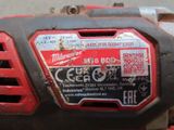 the milwaukee milwaukee m18b power tool is sitting on the ground