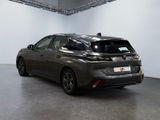 the back end of a grey toyota mira parked in a garage