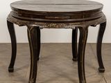 an image of a round table with a wooden top on a wooden floor